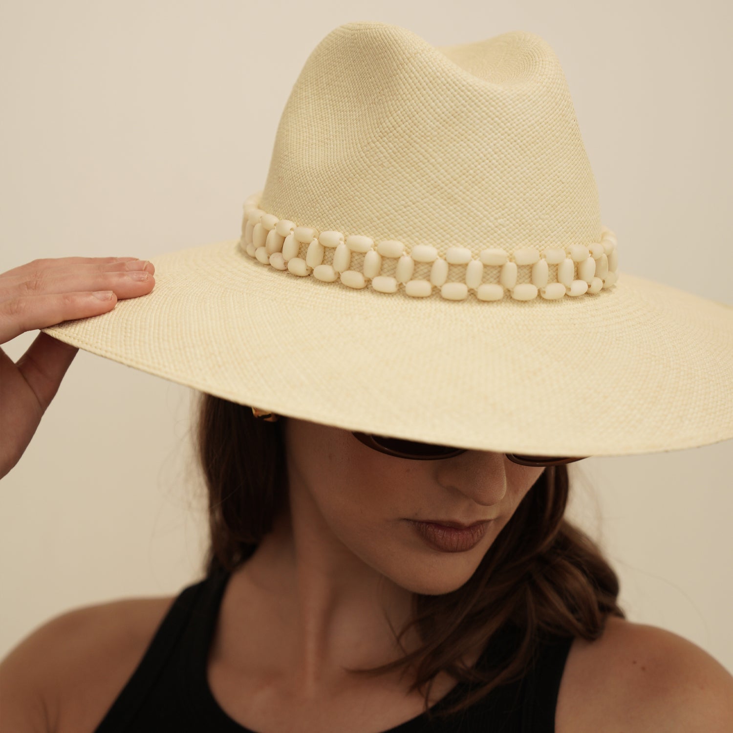 Wide-brimmed straw hat with beaded band made of natural toquilla straw
