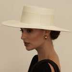 Wide-brimmed white Toquilla straw hat named Pinta, a genuine Panama hat, ethically handcrafted