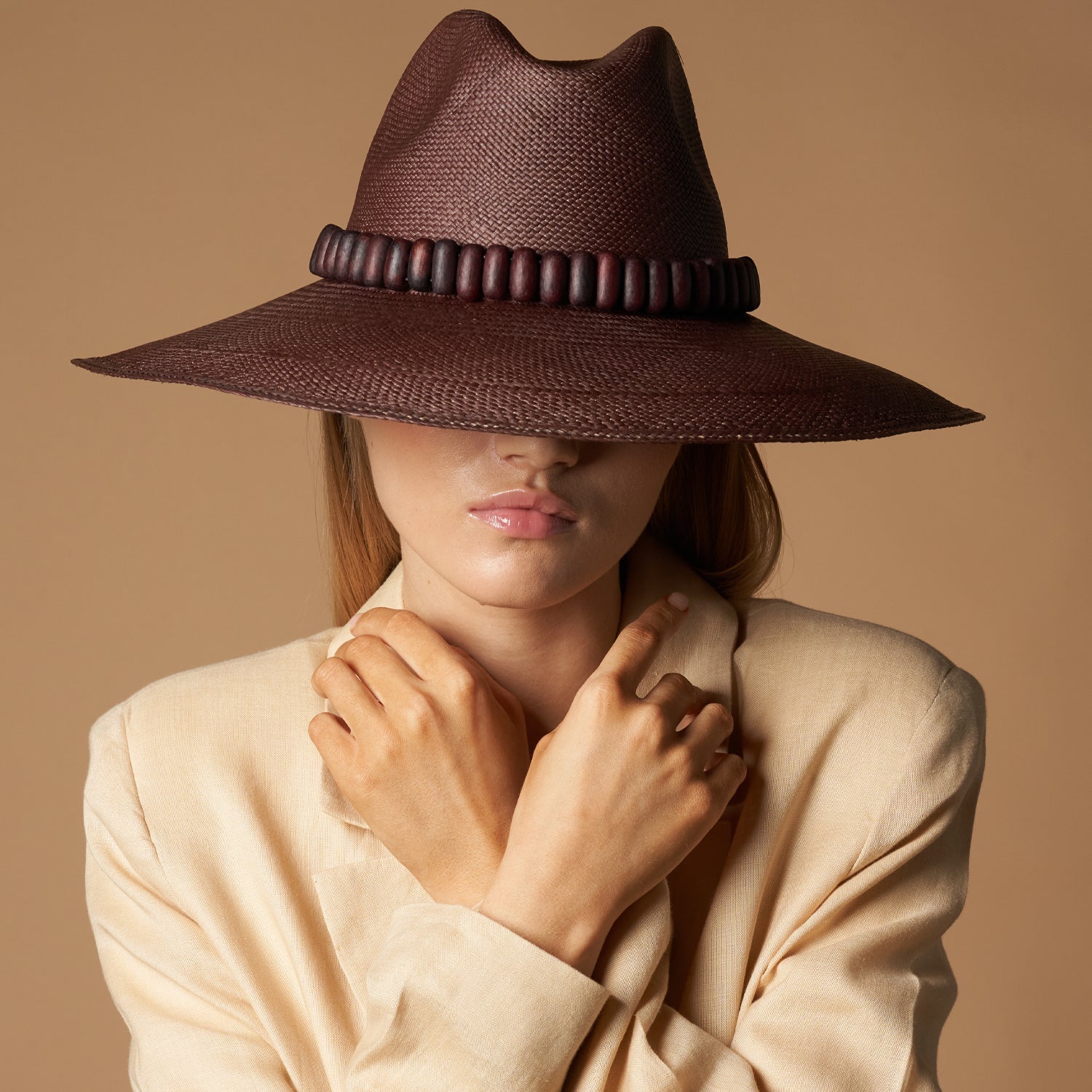 Brown woven Shayak Wide Brim hat with beaded band, made from Toquilla straw