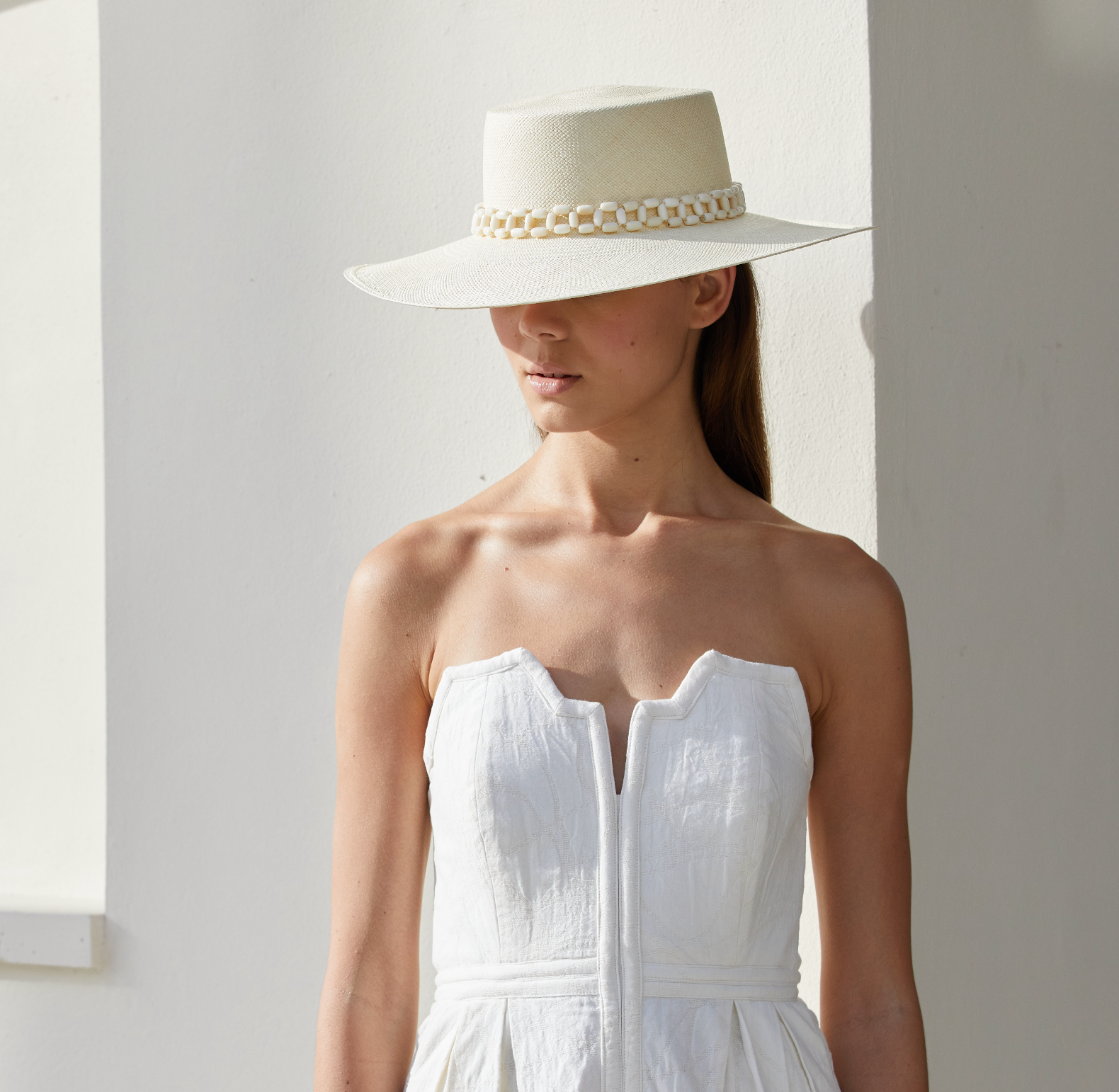 White Tulipan Toquilla straw hat with chain detail and tagua nut accents